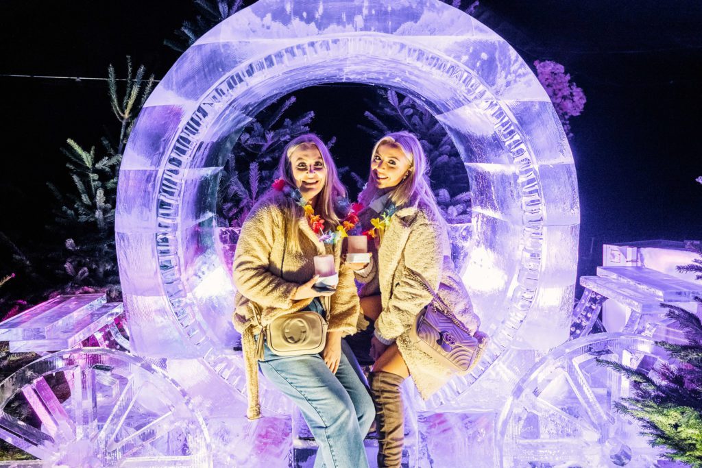 2 people stood posing with ice sculpture
